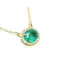 Oval cut emerald necklace for women from Muzo mines Colombia halo natural diamonds, crafted in 14k yellow gold