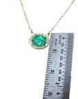 Real Emerald necklaces for sale oval cut from Muzo mines Colombia halo natural diamonds, crafted in 14k yellow gold