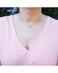 Mother's Day gift necklace oval cut from Muzo mines Colombia halo natural diamonds, crafted in 14k yellow gold