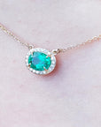 Yellow gold Emerald necklace for women from Muzo mines Colombia halo natural diamonds, crafted in 14k