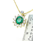 Emerald and diamond necklaces natural Muzo mine oval cut 1.11 carats encircled by halo diamonds crafted in 14k yellow gold