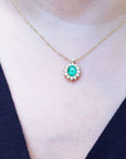 Rea Colombian Emerald necklaces natural Muzo mine oval cut 1.11 carats encircled by halo diamonds crafted in 14k yellow gold
