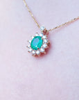 slider women's Emerald necklaces natural Muzo mine oval cut 1.11 carats encircled by halo diamonds crafted in 14k yellow gold