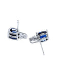 Oval natural blue sapphire stud earrings in 14K white gold with diamond accents.