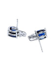 Oval natural blue sapphire stud earrings in 14K white gold with diamond accents.