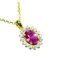 Oval cut pink sapphire halo diamond necklace pendant encircled by a halo of prong-set natural diamonds, in 14k gold.