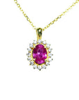 14K yellow gold necklace with an oval pink sapphire halo diamond pendant.