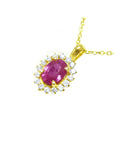 Left side top display of an oval cut pink sapphire halo diamond necklace pendant 14k yellow gold.