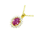 Oval pink sapphire halo diamond necklace pendant in 14K yellow gold.