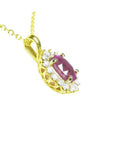 14K yellow gold necklace pendant with an oval pink sapphire and diamond halo.