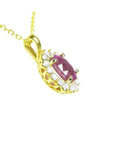 Right side profile of an oval cut pink sapphire halo diamond necklace pendant 14k yellow gold.