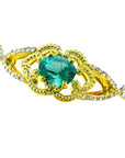 14k yellow gold bracelet with an oval cut natural emerald and accent diamonds for women.