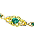 Vintage 14K yellow gold bracelet with oval emeralds and natural diamonds.