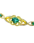 Vintage 14K yellow gold bracelet with oval emeralds and natural diamonds.