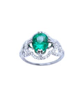 1.55 ct. oval emerald clover ring with diamond halo in 14K white gold.