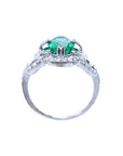 This ring displays the oval cut emerald highlighting the top, side gallery, and band.