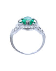 1.55 ct oval emerald clover ring with diamond halo in 14K white gold.