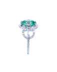 A clean side profile perspective of this natural emerald ring crafted in 14K white gold.