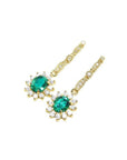 Oval emerald and halo diamond dangle earrings in 14K yellow gold.