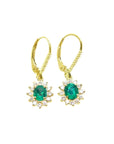 14K gold oval cut Colombian emerald earrings with diamond halo and lever backs.
