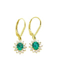 14K gold oval cut Colombian emerald earrings with diamond halo and lever backs.
