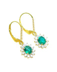 Gold earrings with oval cut natural emeralds and halo diamond in 14k yellow gold right side top view