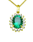 A natural oval cut colombian emerald encircled into a halo diamond pendant necklace in 18k yellow gold.