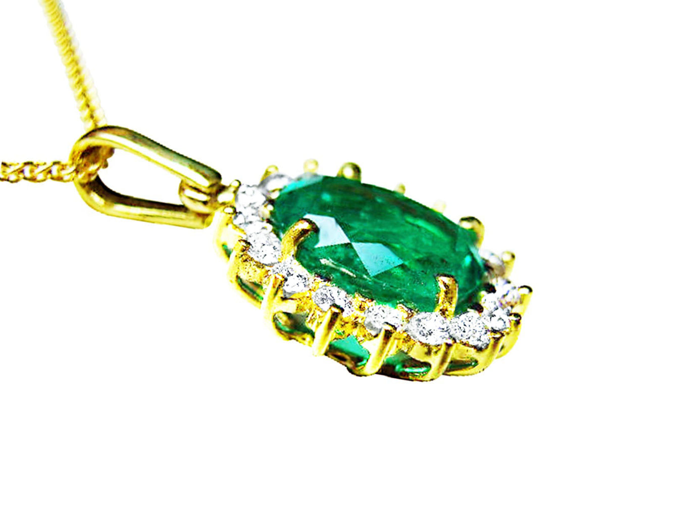 The underside gallery view of a gold emerald pendant oval cut with diamonds.