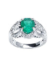 Oval cut natural colombian emerald ring with accent diamonds in 18k white gold.