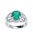 Oval cut natural colombian emerald ring with accent diamonds in 18k white gold.