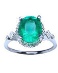 The topside view of an oval emerald ring, with accent diamonds, perfect for mother's day gift.