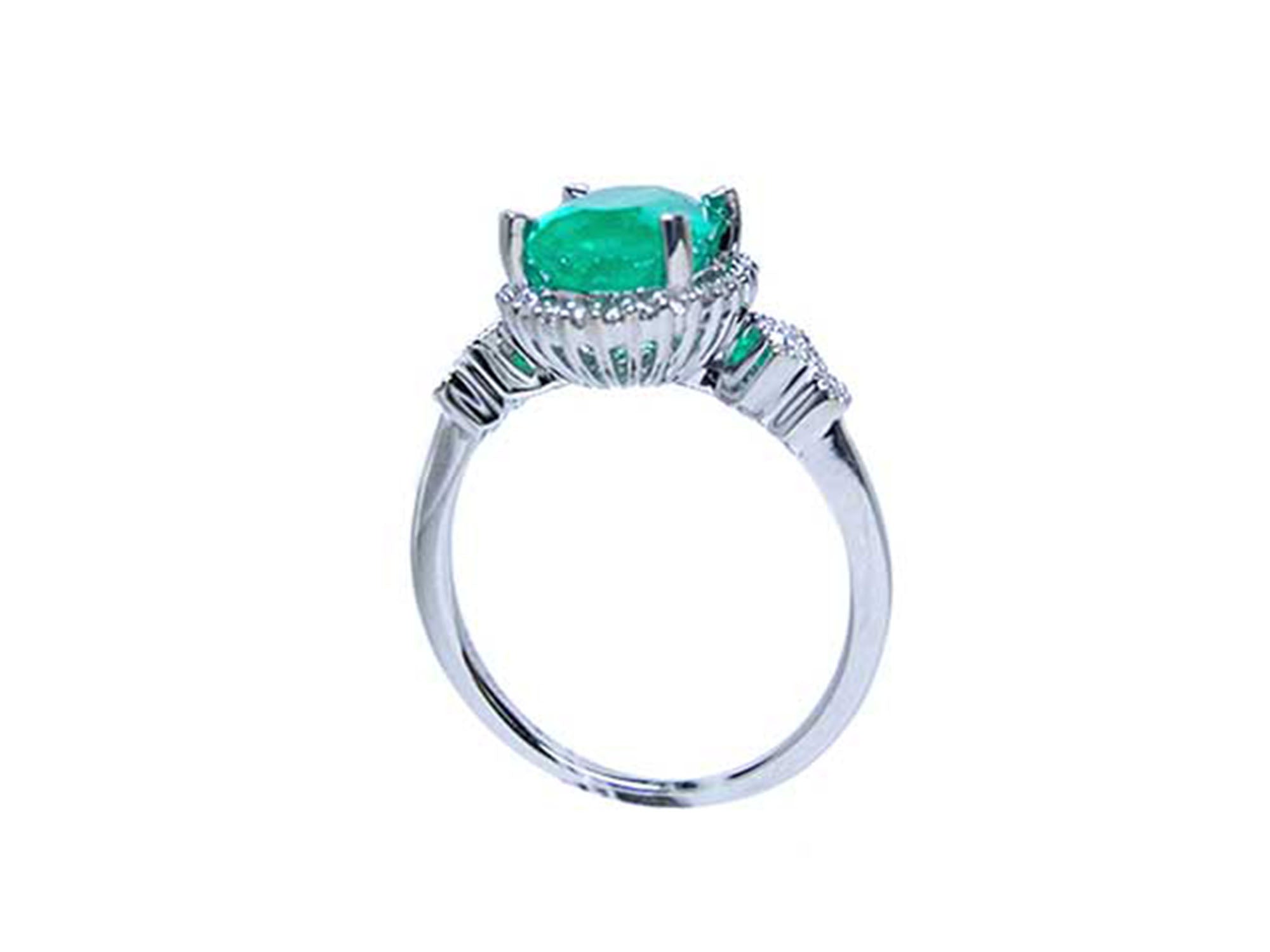 This white gold emerald ring displays the top setting, gallery and band ring.