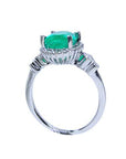 This white gold emerald ring displays the top setting, gallery and band ring.