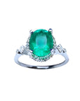 Oval emerald ring, with accent diamonds, made of 14k white gold perfect for mother's day gift.