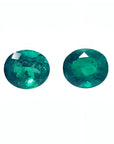Oval cut matched pair loose natural emeralds 1.60 ct. from the Muzo mines in Colombia, sparkling deep bluish green hue.