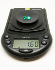 Oval cut matched pair loose natural emeralds 1.60 ct. on digital scale