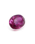 1.31 ct. oval-cut natural Burma ruby gemstone with vivid red and purple hues.