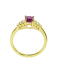 14k yellow gold ring with a deep red oval ruby and sparkling side diamonds.