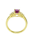 14k yellow gold ring with a deep red oval ruby and sparkling side diamonds.