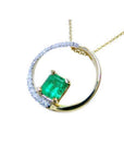 1.08 ct. emerald pendant in 14K gold, with a diamond pavé and polished band "Circle of Life" design.