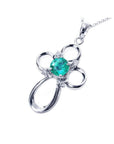 0.57 ct. round Colombian emerald cross pendant in 14K white gold with diamond accents.