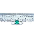 Emerald paper clip necklace with diamonds in 18K white gold, shown with ruler for scale.