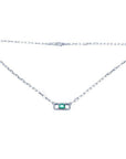 18K white gold paper clip necklace with a vibrant emerald and diamond pendant.