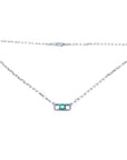 18K white gold paper clip necklace with a vibrant emerald and diamond pendant.