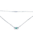 18K white gold paper clip necklace with a vibrant emerald and diamond pendant.