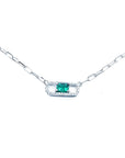 18K white gold paper clip necklace with a vibrant rectangular emerald and diamond halo.