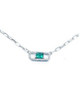 18K white gold paper clip necklace with a vibrant rectangular emerald and diamond halo.