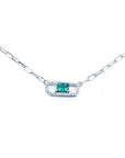 18K white gold paper clip necklace with a vibrant rectangular emerald and diamond halo.