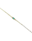 14K yellow gold paper clip bracelet with a rectangular natural emerald and diamond accents.