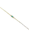 14K yellow gold paper clip bracelet with a rectangular natural emerald and diamond accents.